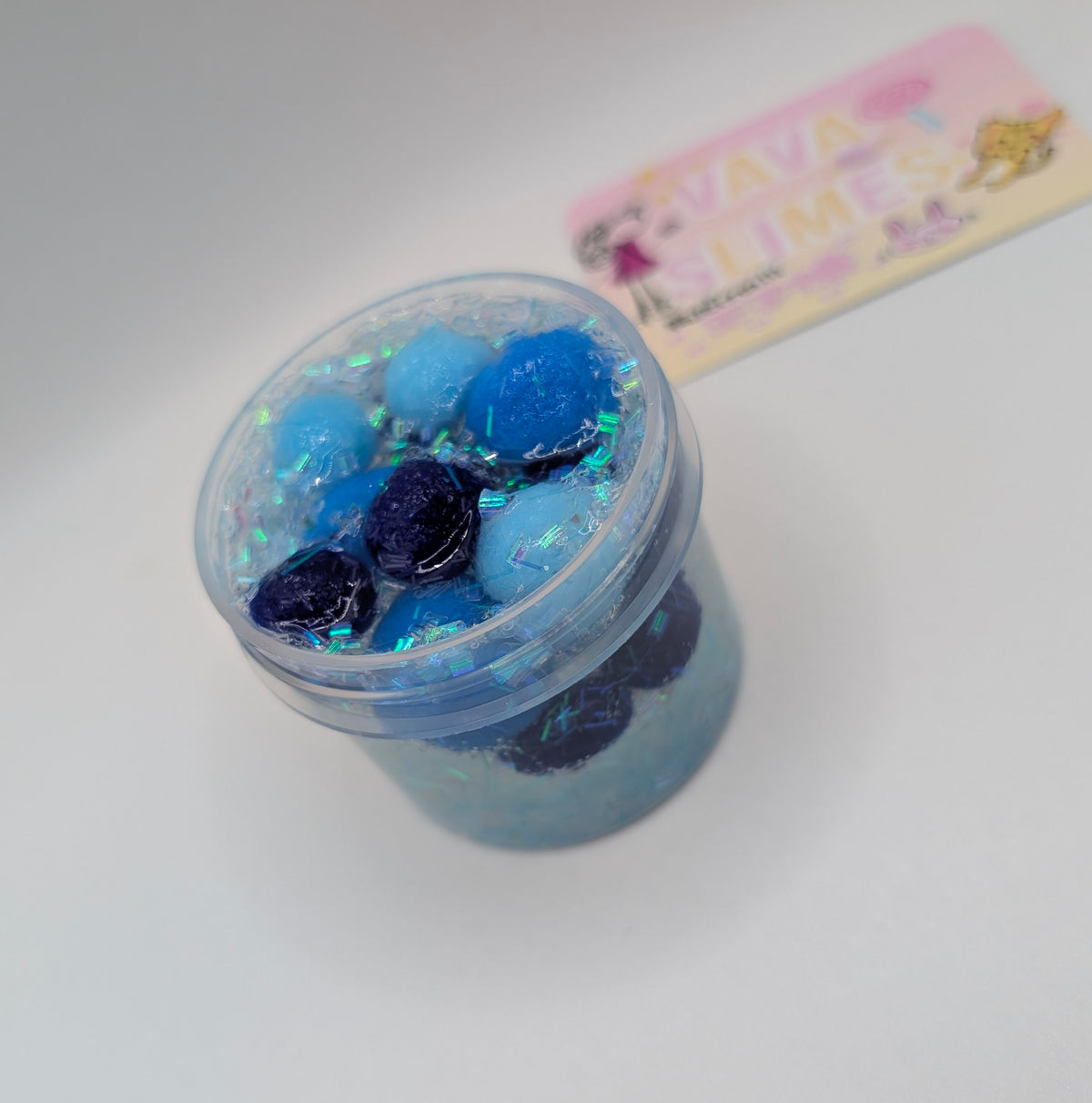 Lando - Clear PomPom slime with iridescent addins