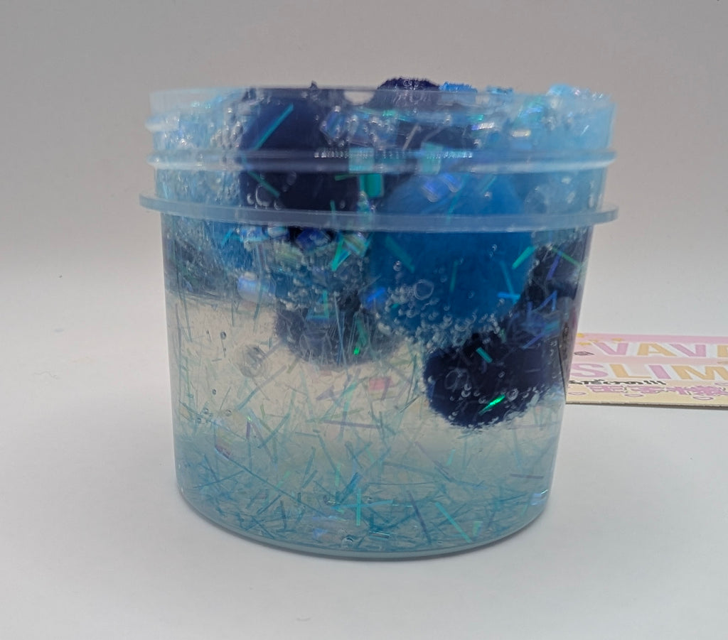 Lando - Clear PomPom slime with iridescent addins