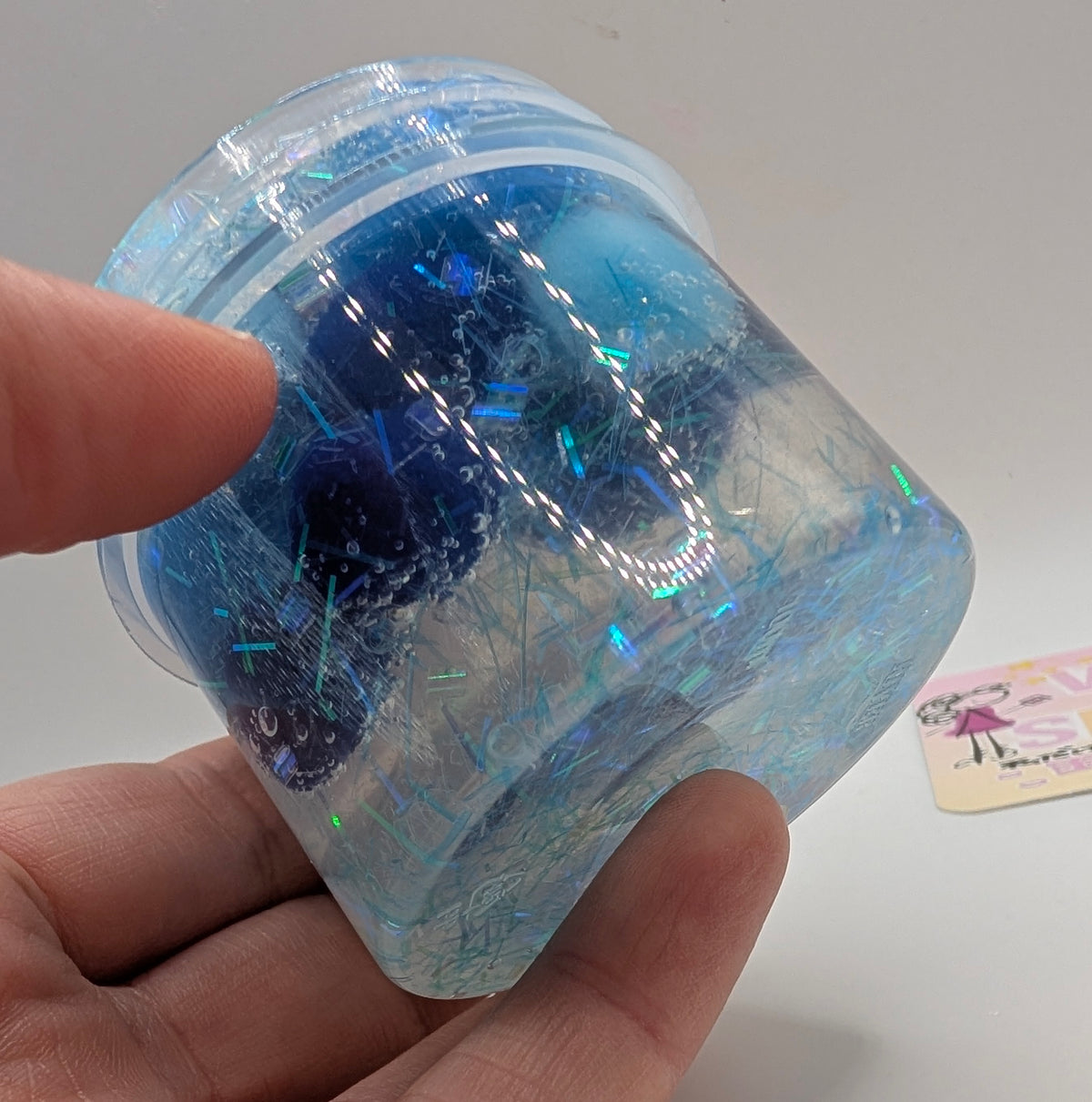 Lando - Clear PomPom slime with iridescent addins