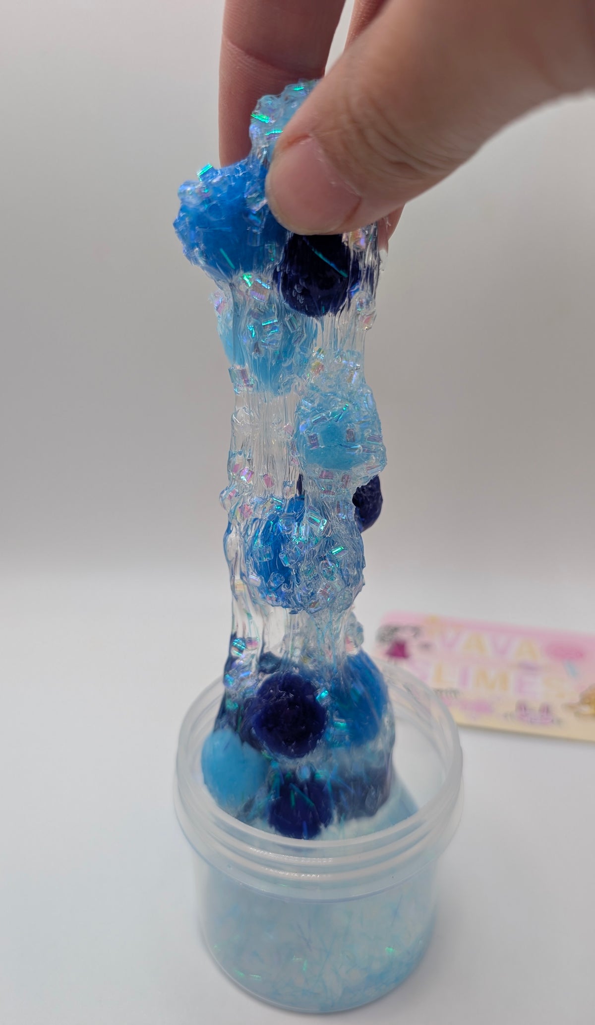 Lando - Clear PomPom slime with iridescent addins